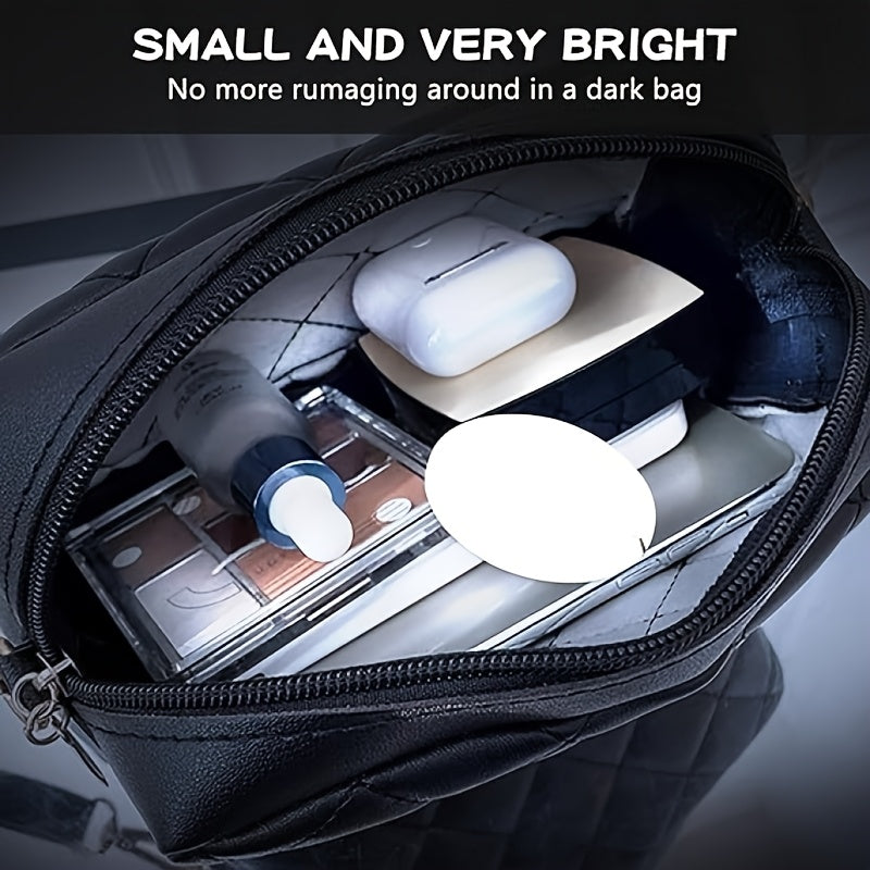 Small round white tracker resting inside an open black bag beside a pair of earbuds